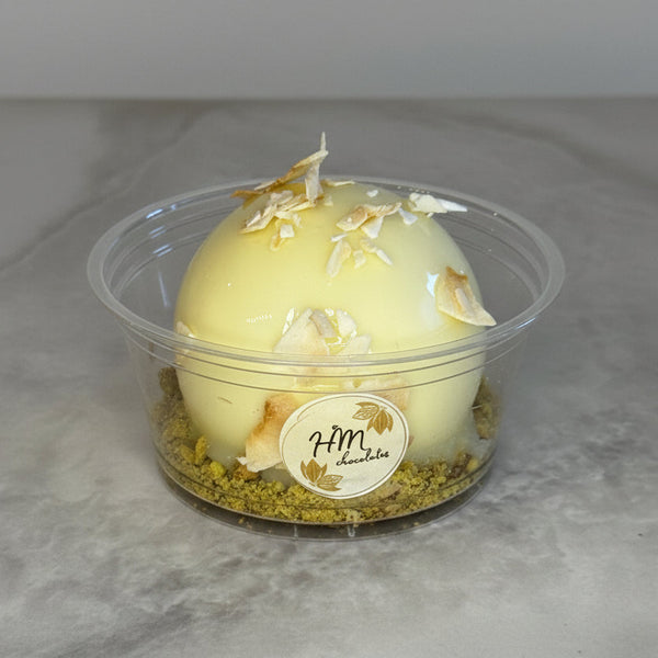 Coconut Mousse Sphere with a Passion Fruit Center, and Banana Cake